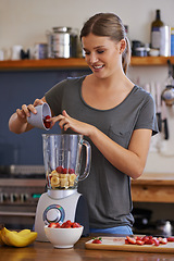 Image showing Kitchen, happy woman and blender for fruit smoothie, nutrition or food for healthy diet at table in home. Person, smile and mixer for drink, juice or strawberry for wellness with organic beverage