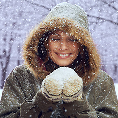 Image showing Snowball, excited and face of woman with snow outdoors for season, snowing weather and cold climate. Travel, fashion and happy person in nature on winter holiday, vacation and weekend in Switzerland