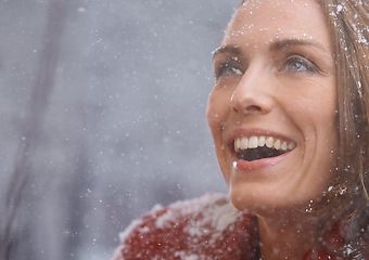 Image showing Happy, excited and face of woman with snow outdoors for season, snowing weather and cold climate. Travel, fashion and person smile in nature on winter holiday, vacation and weekend in Switzerland