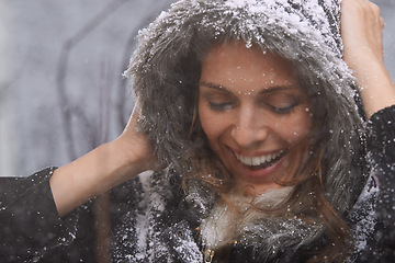 Image showing Nature, happy and face of woman with snow outdoors for season, snowing weather and cold climate. Travel, fashion and person in trendy clothes on winter holiday, vacation and weekend in Switzerland
