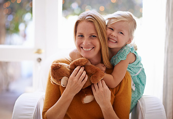 Image showing Happy mom, portrait and hug with child or teddy bear for love, care or support together in living room at home. Face of mama, kid or daughter with smile for embrace, affection or mothers day at house