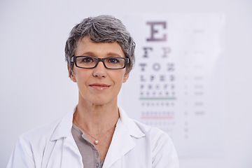 Image showing Portrait, senior woman and optometrist for eye care, letter chart for exam with doctor at clinic. Alphabet, glasses for vision and prescription lens, assessment and ophthalmology for spectacles