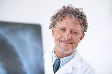 Image showing Senior man, doctor and portrait with xray for healthcare, injury analysis or anatomy with radiology and smile. Mature, face or health expert or happy for diagnosis or confidence for results in clinic