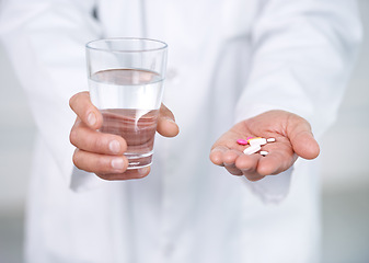 Image showing Medicine, pills and water in hands of doctor in clinic or hospital to offer of healing healthcare. Medical, drugs or person giving pharmaceutical supplements to drink as cure for pain of sick patient