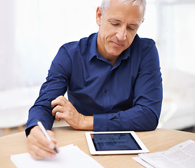 Image showing Notebook, writing and mature businessman with tablet screen in home office for graph, chart or data analysis, research or statistics. Finance, freelance or male accountant with digital, budget or app