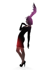 Image showing Woman, feather and head for fashion in studio for fantasy or magic with unique creativity for art or illusion. Female person, isolated and white background for designer clothes, diva and surreal