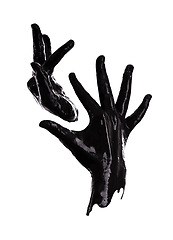 Image showing Hand, paint or black in pollution, art or abstract as symbol of oil spill in monochrome in studio. Fingers, liquid or gesture as still life, creativity or minimalist silhouette on white background