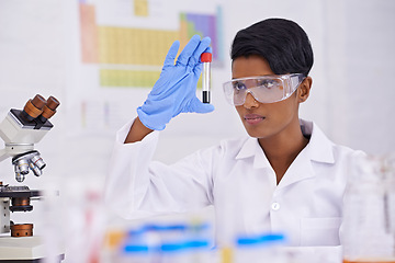 Image showing Blood, dna and scientist with test tube in laboratory for scientific research or experiment. Medical, science and professional woman researcher with pharmaceutical dna in glass vial for medical study