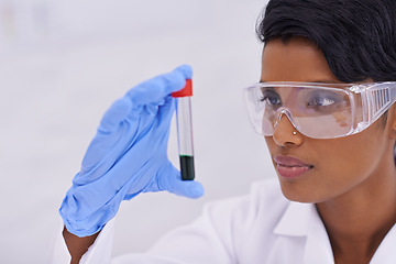 Image showing Blood, scientist and woman with test tube in laboratory for scientific research or experiment. Medical, science and professional researcher with pharmaceutical dna in glass vial for medical study.