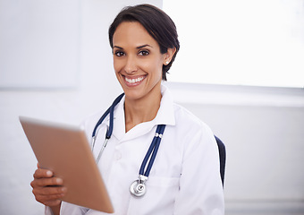 Image showing Portrait, doctor and happy woman with tablet in hospital for healthcare, wellness or telehealth online. Face, smile and medical professional with technology, employee or expert physician in Brazil