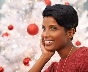 Image showing Woman, thinking and smile by Christmas tree in home, lounge and excited for festive season. Black female person, religious holiday and ready for celebration in living room, happiness and tradition