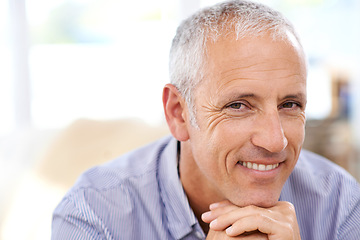 Image showing Mature, man and portrait for relax in home with happiness, retirement and wellness in living room. Senior, person and face with smile, confidence and peaceful in lounge of apartment on the weekend