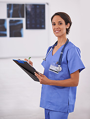 Image showing Portrait, nurse and happy woman writing on checklist in hospital for healthcare, wellness and service. Doctor, smile or medical professional with clipboard, surgeon or radiologist in clinic in Brazil