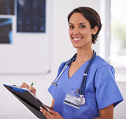 Image showing Portrait, nurse and happy woman writing on clipboard in hospital for healthcare, wellness and xray. Face, smile and medical professional with checklist, surgeon or radiologist in clinic in Brazil