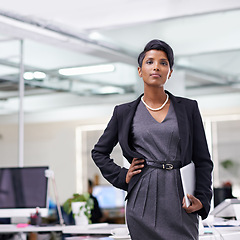 Image showing Business, portrait and serious Indian woman with documents in office for planning, report or company invoice review. Face, finance and female accountant with paperwork, admin or compliance form