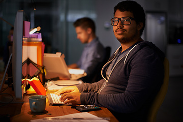 Image showing Portrait, male programmer and late night with computer, deadline and online worker. Dark, person or digital internet specialist in evening for work, office and tech expert or coding in workplace