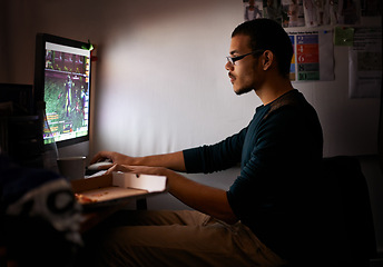 Image showing Night, gamer or man with computer, tech or typing with esports or programmer with nerd or geek. Person, home or guy with pc or online competition with dark room or rpg player with network or internet