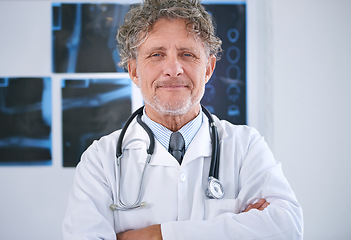Image showing Senior man, doctor and portrait or arms crossed in office for healthcare, medical support and medicine career with stethoscope. Mature, face and health expert with confidence for radiology in clinic