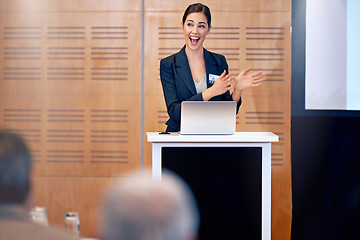 Image showing Happy woman, laptop and business presentation with projector in meeting, discussion or seminar at conference. Young female person, employee or speaker talking on podium to group in corporate workshop