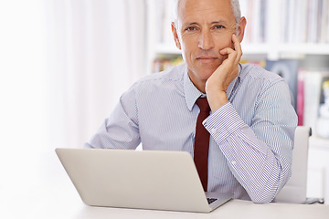 Image showing Laptop, portrait and senior businessman in office thinking, planning or checking email, review or social media feedback. Face, calm or old male executive with pc for online, research or communication