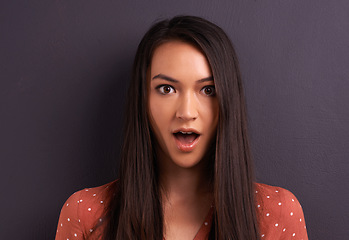 Image showing Portrait, surprise and woman in shock in studio, mouth open and isolated on a grey background. Face, wow and amazed model with wtf facial expression for announcement of gossip, news or information