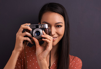 Image showing Woman, portrait and film camera for photography in studio for vintage creativity, grey background or mockup space. Female person, face and equipment for picture career or memory fun, lens or photo