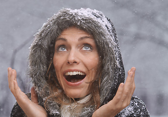 Image showing Nature, excited and face of woman with snow outdoors for season, snowing weather and cold climate. Travel, happy and person with snowflake on winter holiday, vacation and weekend in Switzerland