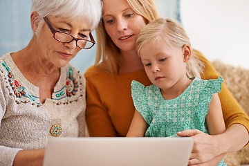 Image showing Family, laptop and internet at a home with grandmother, girl and mother together with game. Learning, online and senior woman with child and mom with love, support and care in a house with tech