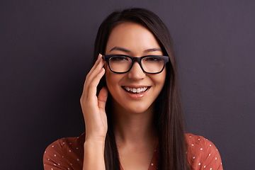 Image showing Portrait, optometry and woman with glasses, happiness or person on grey studio background. Face, model or girl with eyewear or mockup space with smile, joy or iris with sight or see with clear vision