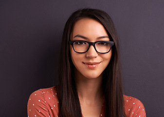 Image showing Portrait, smile and woman with glasses, happiness and person on a grey studio background. Face, model and girl with eyewear and mockup space with optometry and iris with sight and see with looking