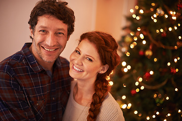 Image showing Couple, portrait and Christmas, holiday celebration and festive season of giving for love and commitment. Happiness, hug and support with people at home for tradition, romance and relationship