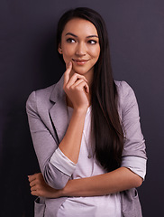 Image showing Thinking, smile and woman with vision in studio, brainstorming or remember memory isolated on a grey background. Dream, happy person and inspiration for decision making, idea and planning future