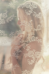 Image showing Profile, naked and sensual woman with lace curtain for desire or tempting, seductive and passionate to allure. Female person, nude and mystery with elegance and temptation, sexy and vintage.