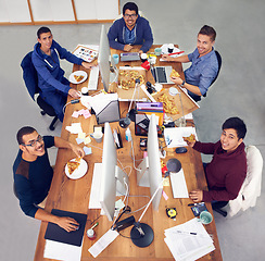 Image showing Business team, men and portrait while eating with top view for deadline, pizza and coworking company. Programmer, collaboration and working on lunch with fast food, happiness and software development