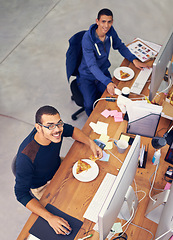 Image showing Businessman, portrait and lunch while working in office with smile for pizza break, technology and coworking company. Programmer, employee and face with fast food, coding team and eating at desk