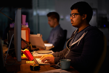 Image showing Coding, computer and night with programmer man at desk in office for cyber security development. Fast food, programming and software with confident young game developer in workplace for overtime