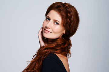 Image showing Woman, hairstyle and confident with haircare in studio on white background with satisfied look and healthy. Portrait, female person and routine for natural hair, repair and fresh for beauty.
