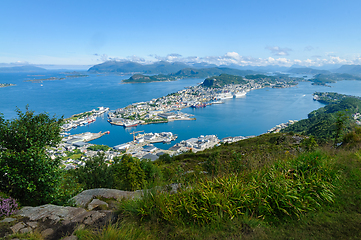 Image showing Majestic vista of a coastal town nestled among islands under a c