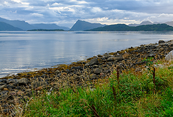 Image showing Tranquil waters and rocky shores: a serene scandinavian twilight