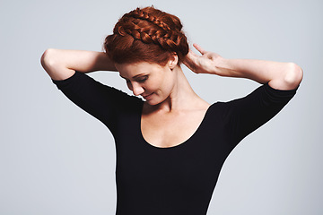 Image showing Woman, hair and braid crown for beauty in studio, elegant hairstyle for glamour and redhead on white background. Haircare, shine and texture with model fixing plait, cosmetic care and wellness