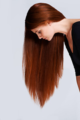 Image showing Woman, red hair and beauty with cosmetic care, keratin treatment for shine with healthy growth on white background. Redhead, ginger and haircare for wellness, volume and texture with length in studio