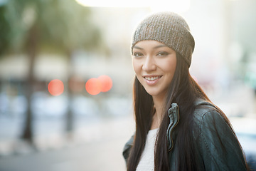 Image showing Portrait, smile and beanie with woman, street and happiness with winter and cold with travel and journey. Face, person and outdoor with girl or New York with knitted cap or cheerful with morning walk