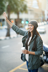 Image showing Woman, fashion and ride with call, urban and city street or background for style. Asian student, beanie and jacket in cape town with winter, cold and travel with adventure or holiday for confidence