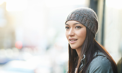 Image showing Thinking, city and ideas with woman, cold and choice with peace and morning with winter weather. Person, outdoor and girl with a beanie, New York or wool cap with happiness and urban town in a street