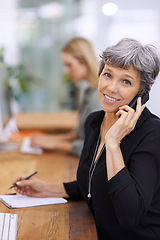 Image showing Portrait, phone call and mature manager writing notes, talking or coworking in office. Face, happy woman and ceo on cellphone with book for information, business or consultant in conversation at desk