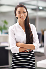 Image showing Portrait, happy or young businesswoman in office or professional person with arms crossed in job confidence. Positive, face or journalist for career satisfaction, pride or talent as writer in company