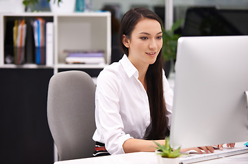 Image showing Woman, office and pc in desk with smile for work with typing notes, documents and online schedule as assistant. Administration, female person and happy on computer for internet or website for search.