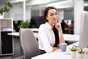 Image showing Office, smile and portrait of woman with monitor at desk for research, report review or administration. Happy, face and employee with technology for hr, compliance and ready for work with coffee