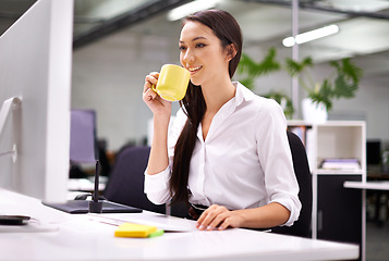 Image showing Coffee, computer and business woman in office reading information for research on internet. Technology, smile and professional female designer working on desktop and drinking cappuccino in workplace.