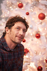 Image showing Man, thinking and Christmas tree for holiday celebration for vacation thoughts, lights or ornaments. Male person, contemplating and festive season for gift giving event for relax, present or idea